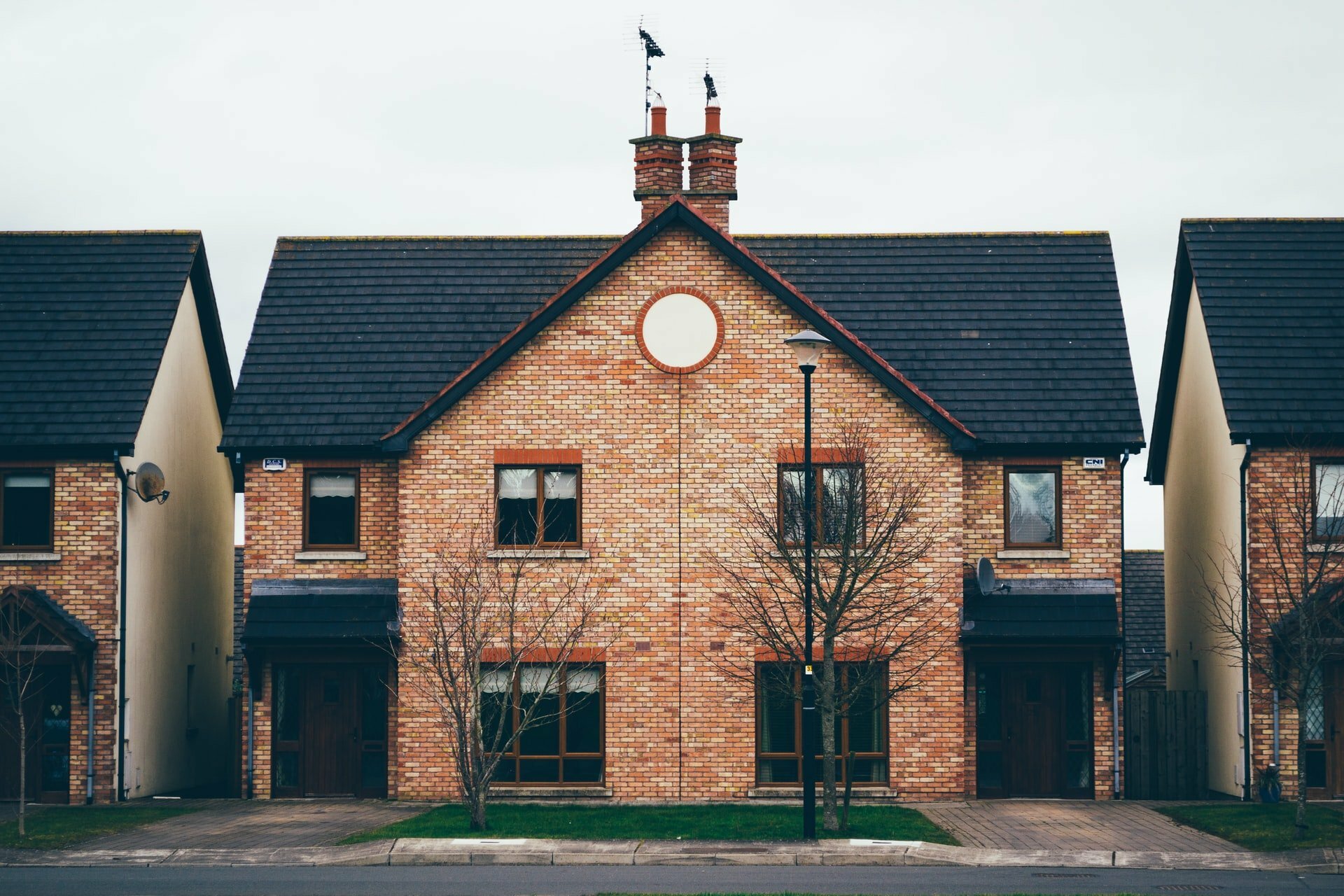 a brick building with a clock on it