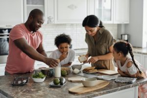 a family preparing food in the kitchen