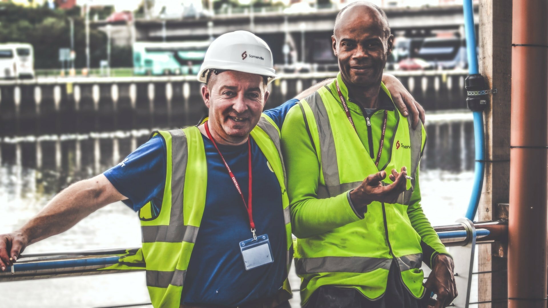 a couple of men wearing hard hats