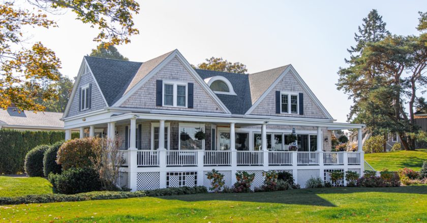 a house with a lawn and trees