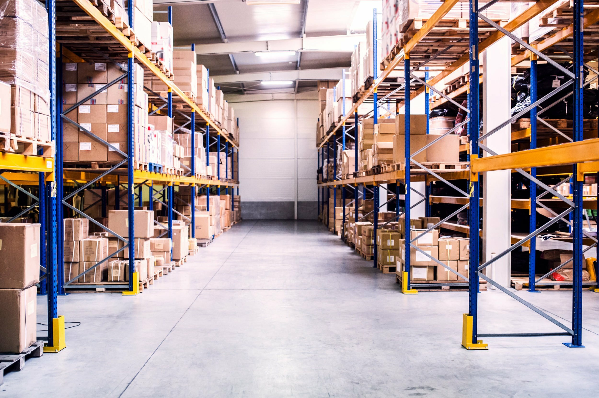 a warehouse with shelves and ladders